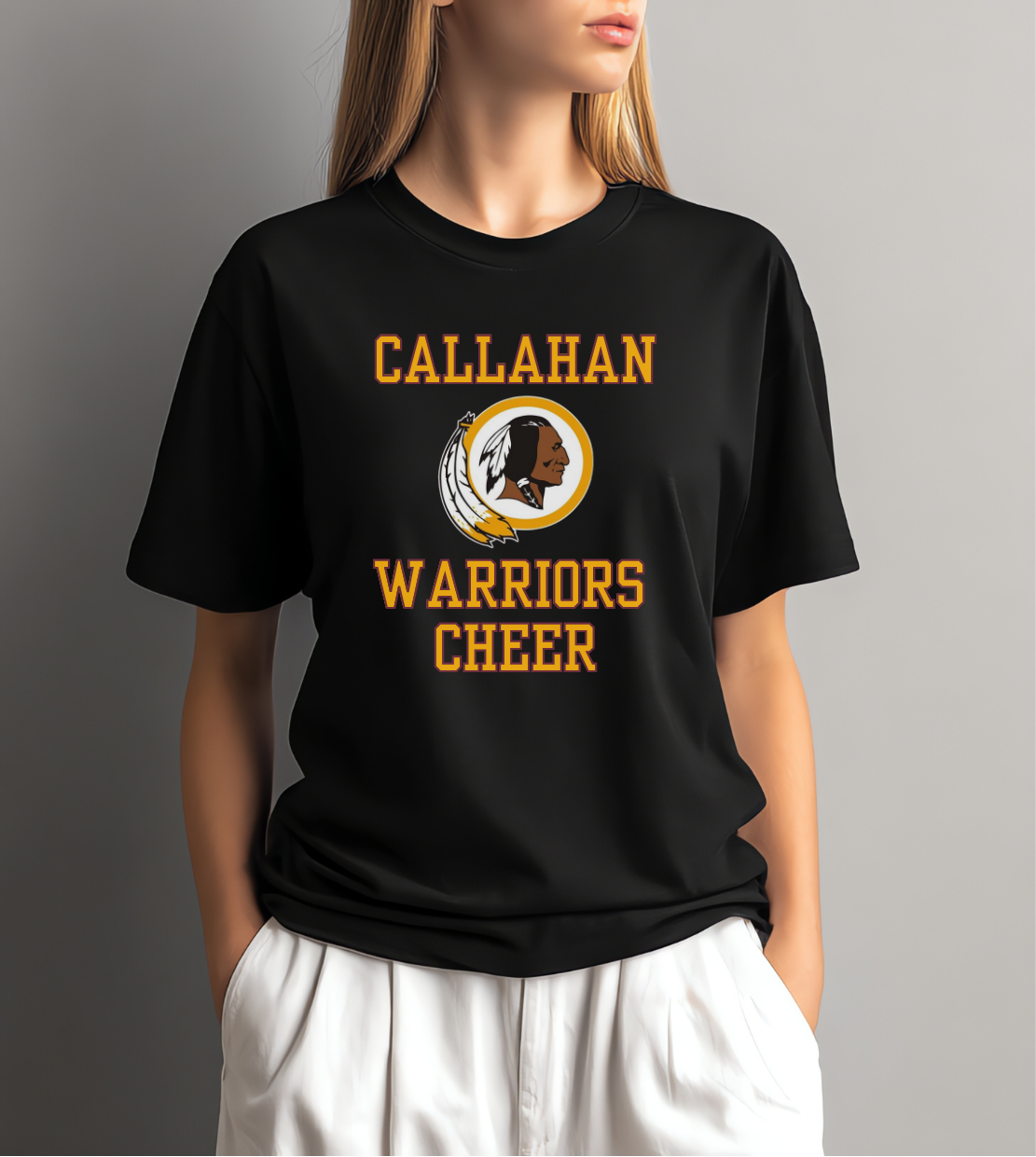 Person wearing a black t-shirt with 'Callahan Warriors Cheer' text and logo on a gray background