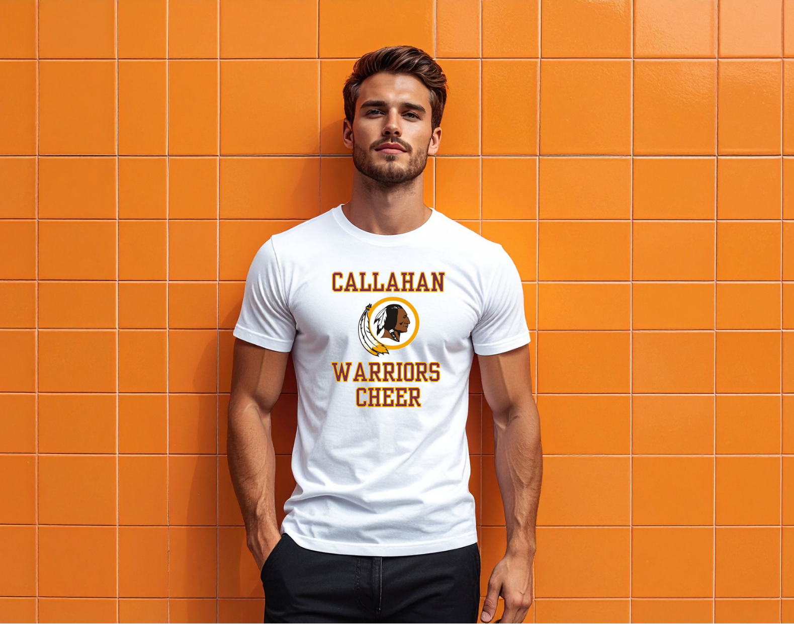 Man wearing a white t-shirt with 'Callahan Warriors Cheer' design against an orange tiled wall.