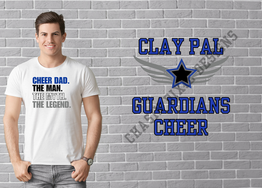 Man wearing a white t-shirt with text in front of a gray brick wall